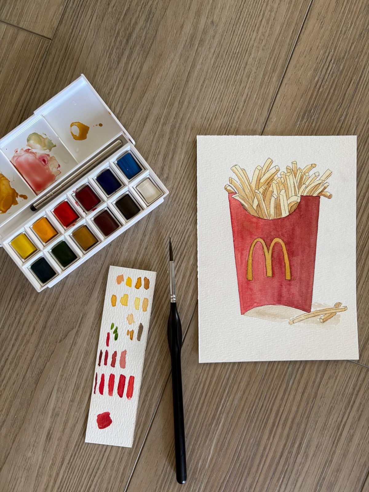 Watercolor painting of a box of fries